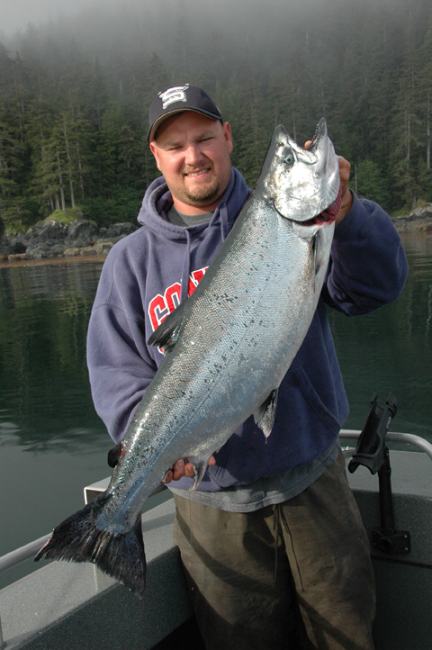 Eric with a fat king salmon he caught at the Tree Hole in late July